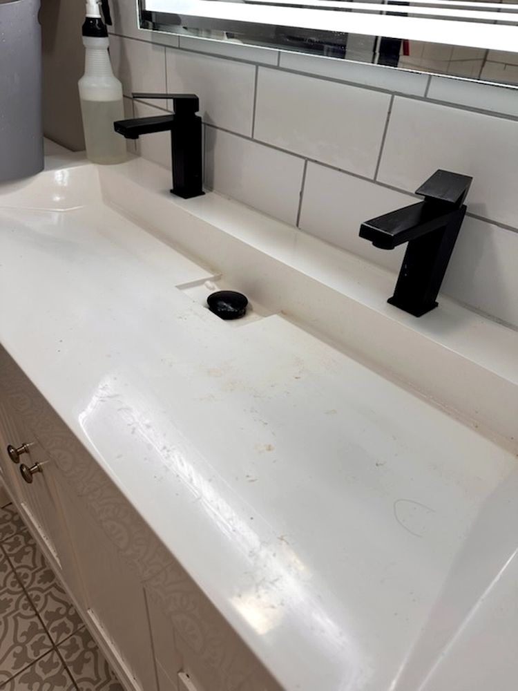 Stained bathroom sink before cleaning